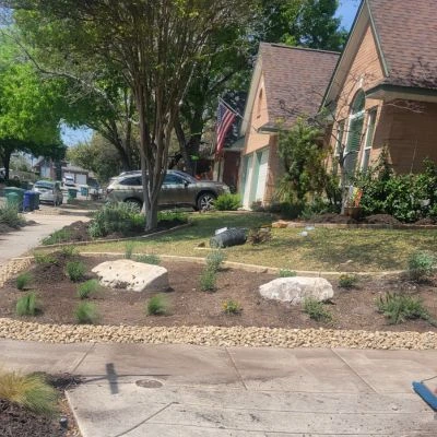 Rock bed with grass in Schertz, TX